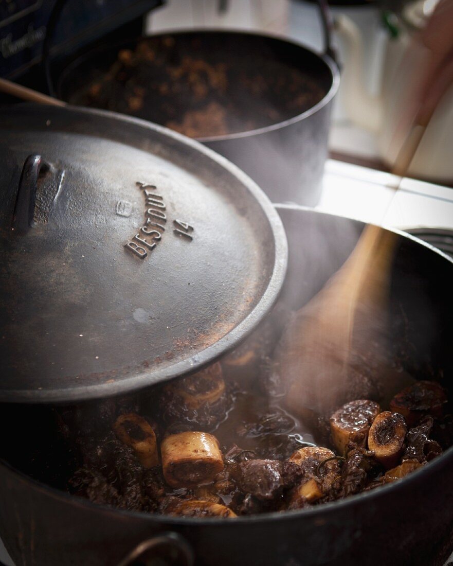 Ossobucco being braised in a pot