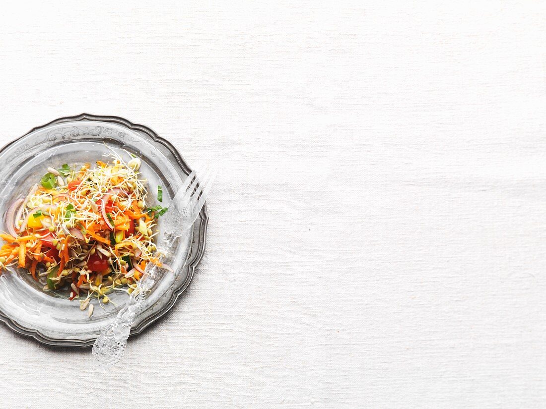 A colourful lentil sprout salad with vegetables