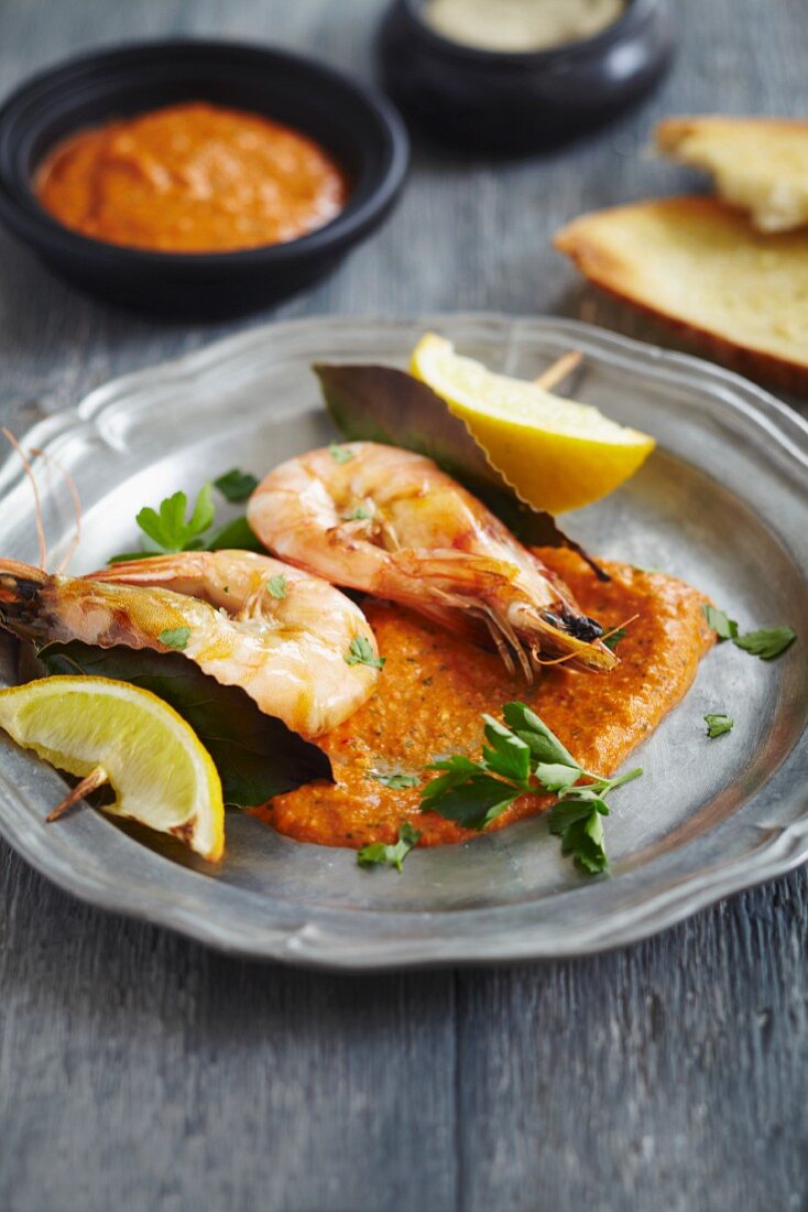 King prawns served with red pepper hummus