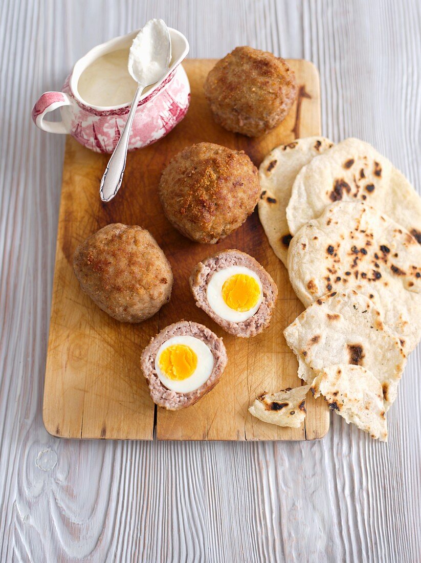Scotch eggs with horseradish sauce and unleavened bread