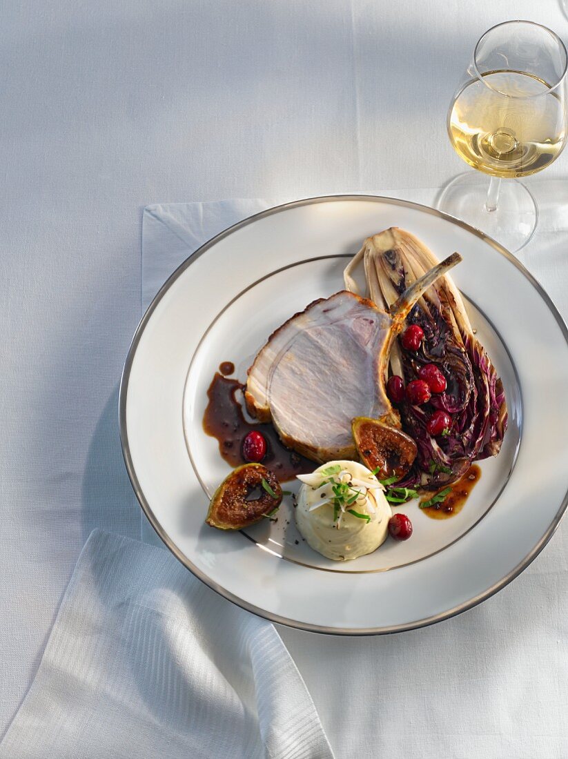 Rack of pork with radicchio, figs and cranberries