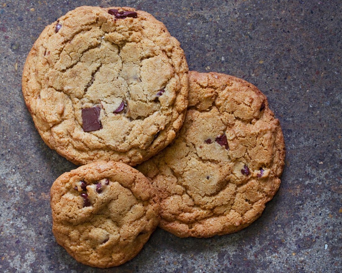 Three chocolate chip cookies (seen from above)
