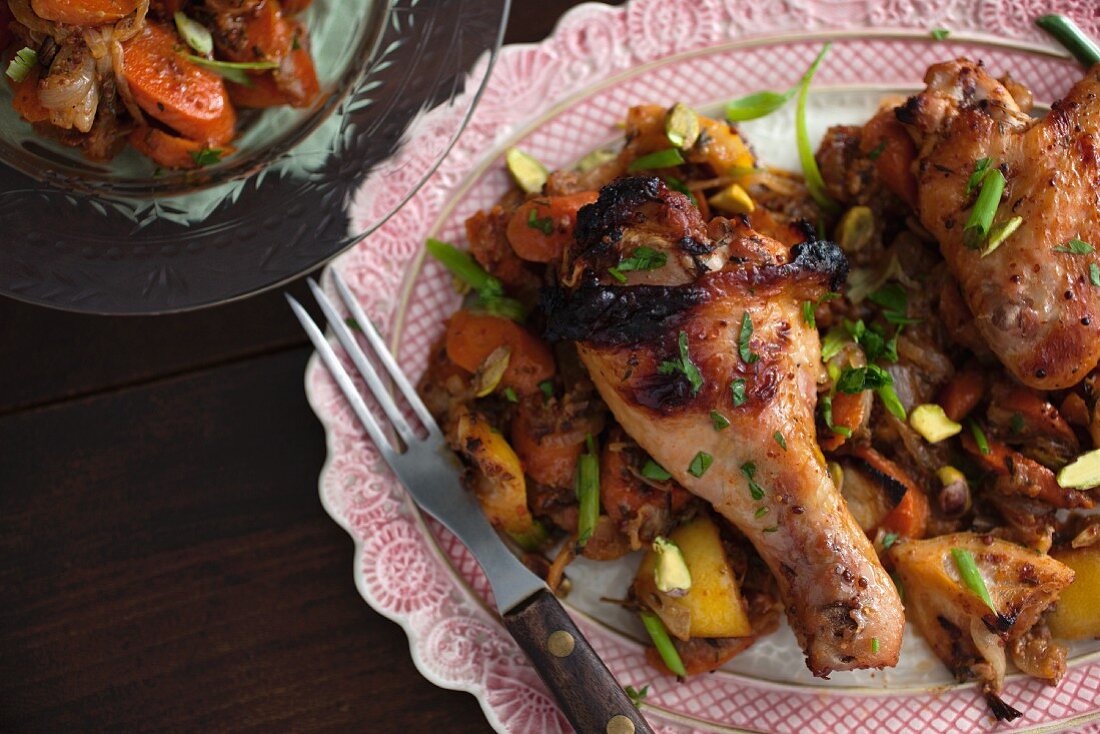 Roasted chicken drumsticks with carrots, lemons and pistachios