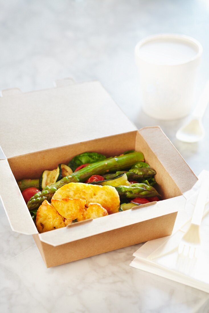 Roasted vegetables with halloumi in a takeaway box