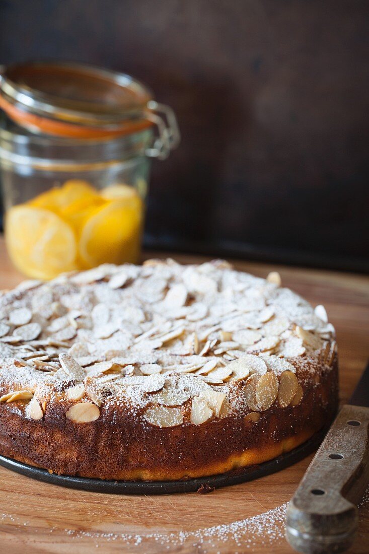 Lemon ricotta cake with almonds and icing sugar