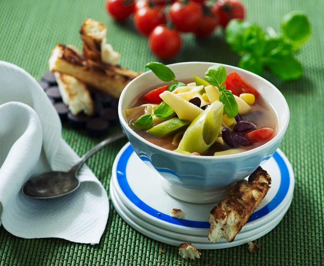 Minestrone with pasta served with grilled bread