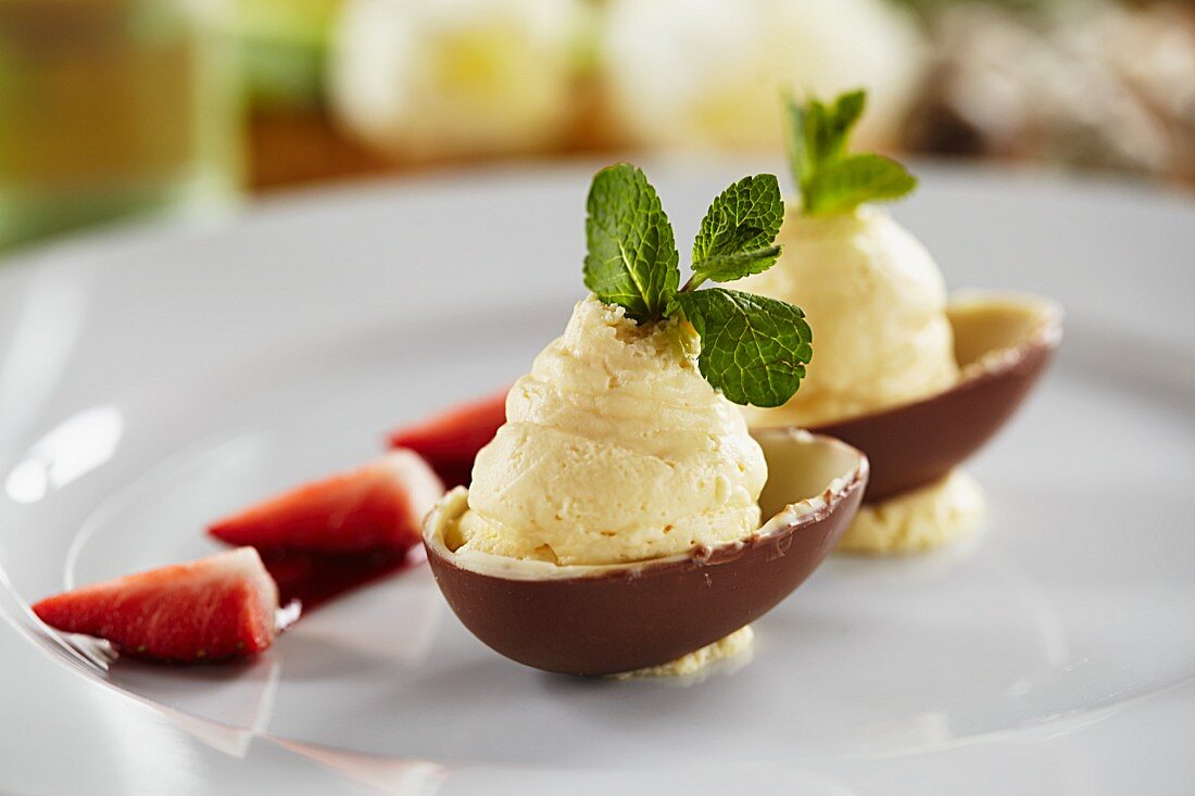 White chocolate mousse with peppermint served in chocolate egg halves for Easter
