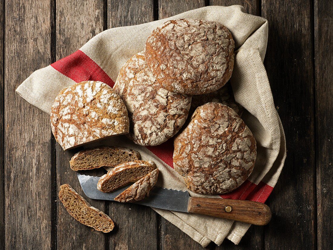 Vinschgau bread on a cloth with a knife