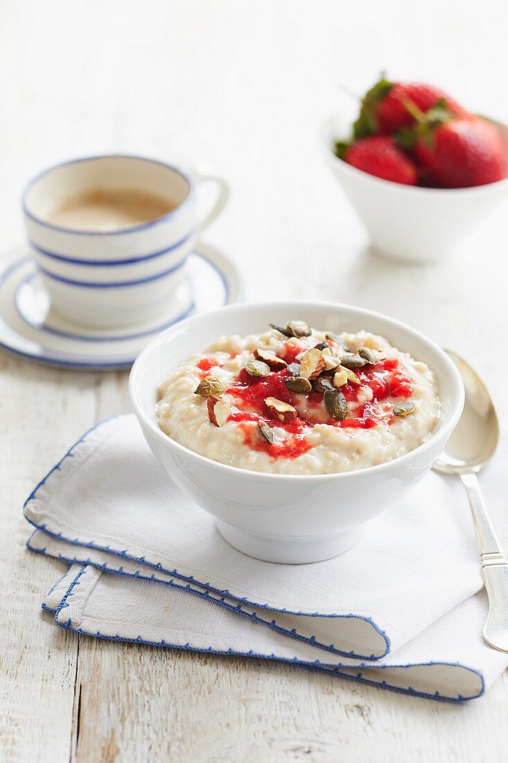 Rice pudding with strawberries and chopped nuts
