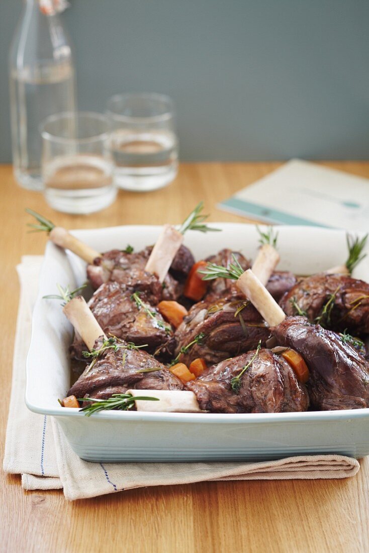 Roasted lamb shanks with rosemary, thyme and carrots