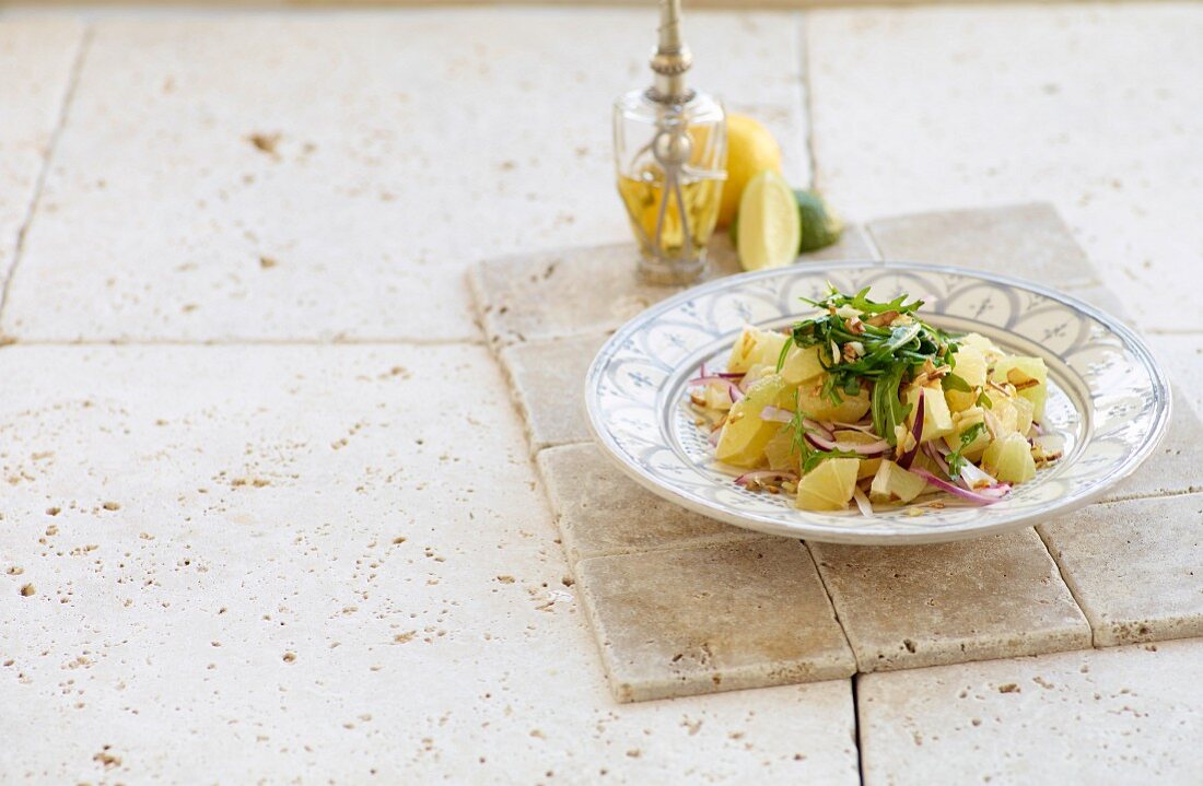 Lemon and lime salad with fried rocket