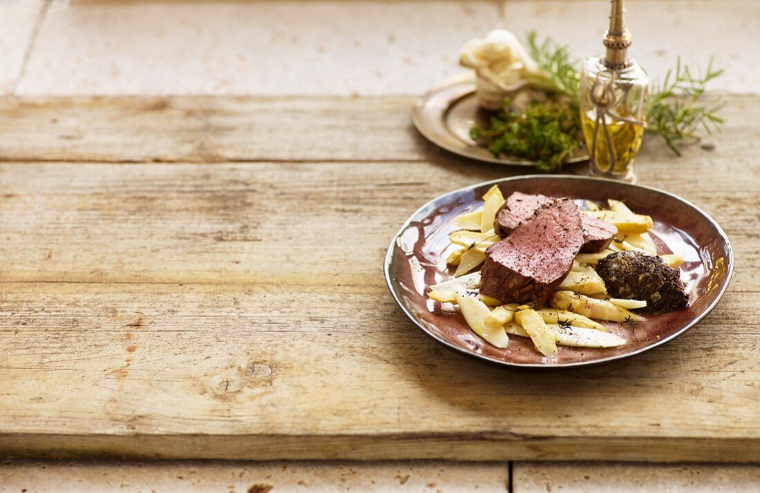 Beef fillet with caramelised asparagus served with tapenade