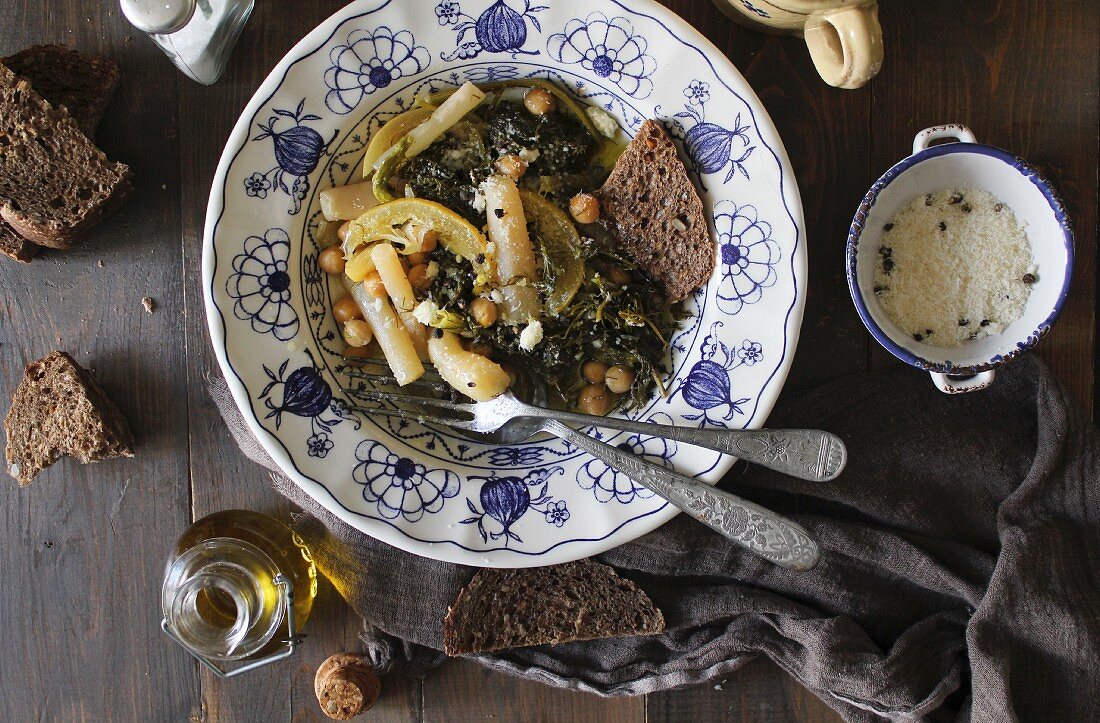 Chickpea stew with herbs, white asparagus and black bread