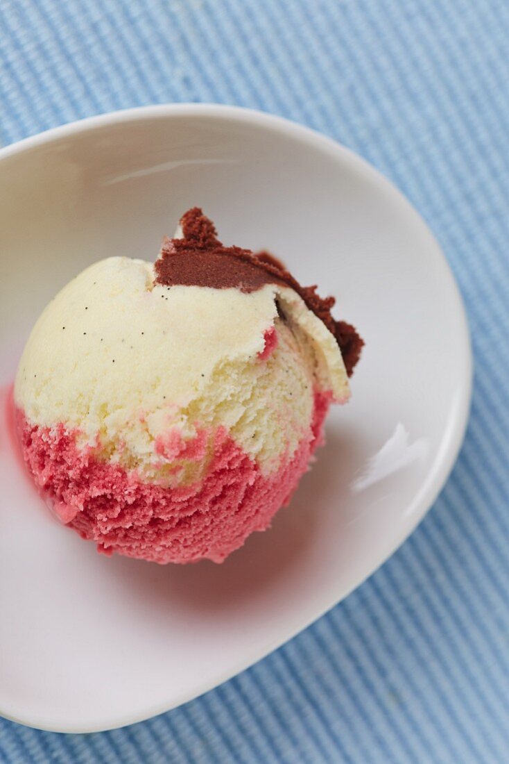 A scoop of homemade Neapolitan ice cream in a bowl