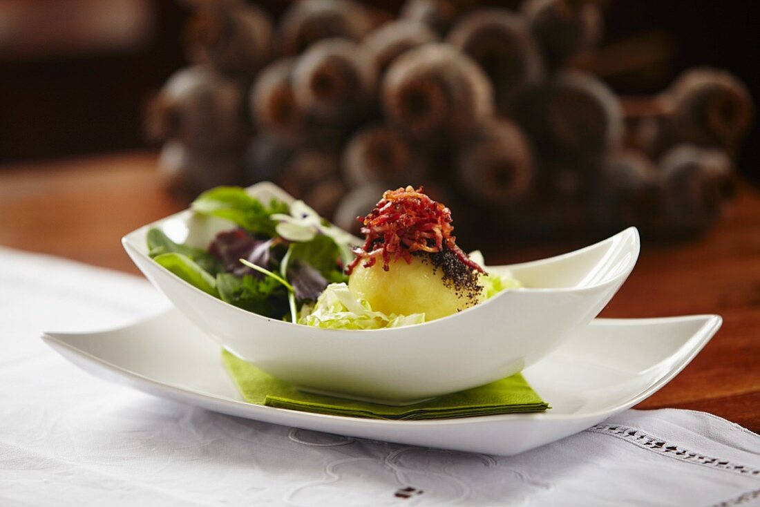 Poppyseed and bacon dumplings with a cold cabbage salad