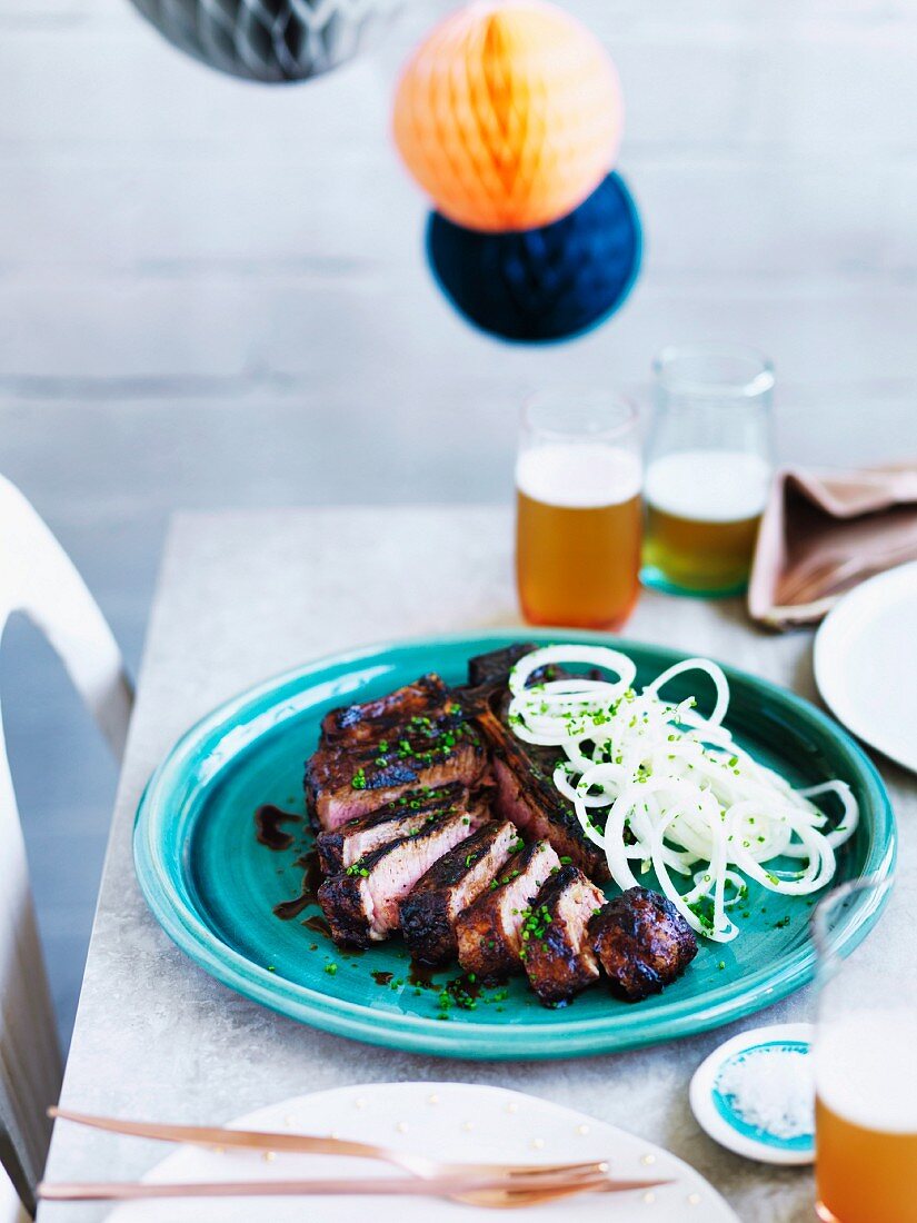 Teriyaki T-bone steak with onions