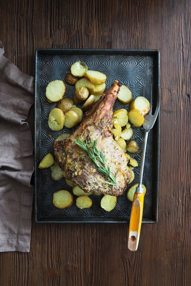 Roasted leg of lamb with potatoes and rosemary