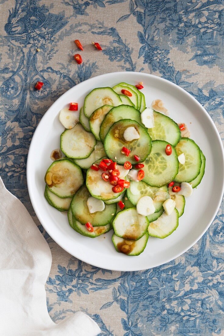 Courgette and cucumber salad with garlic and chilli rings