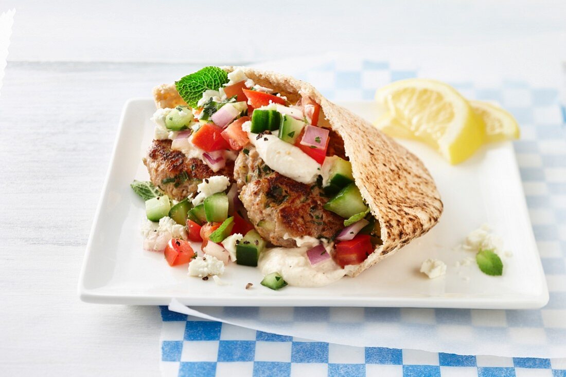 Turkey meatballs with cucumber and feta cheese in pita bread