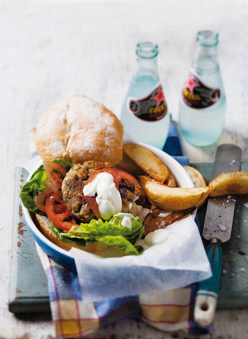 Hake cakes with roast potatoes and a roll