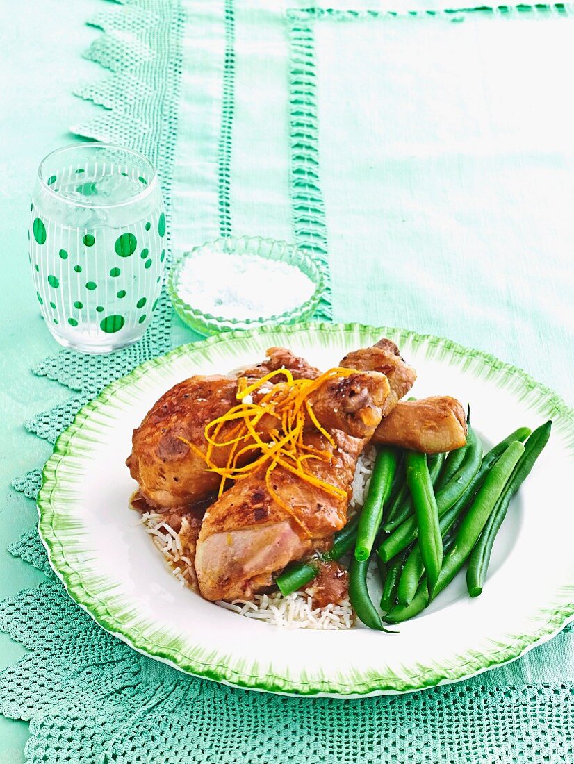 Orange drumsticks with rice & green beans