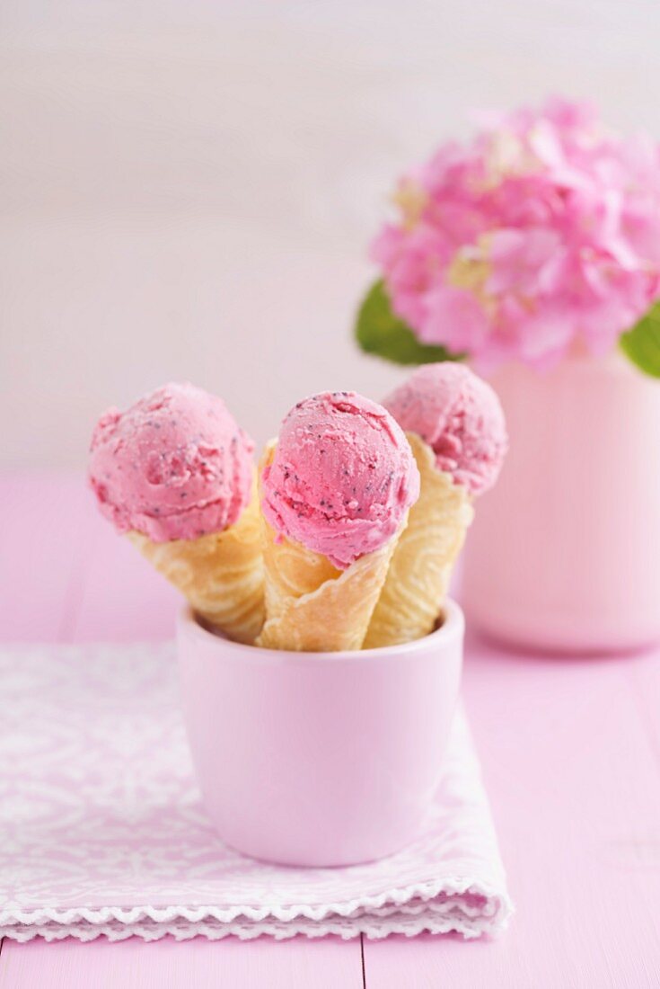 Raspberry ice cream in homemade ice cream cones