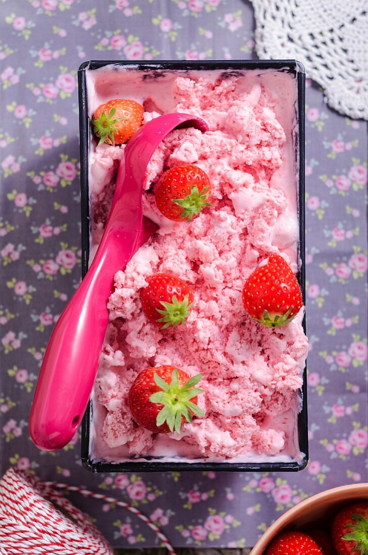 Strawberry ice cream in a baking tin