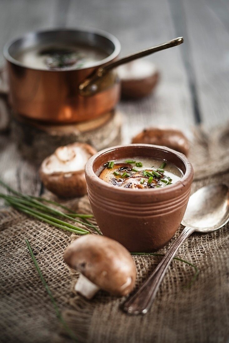 Cream of mushroom soup with chives and fried mushrooms