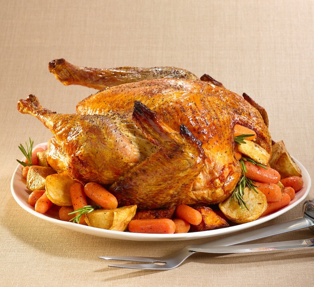 Roast turkey with rosemary, carrots and potatoes