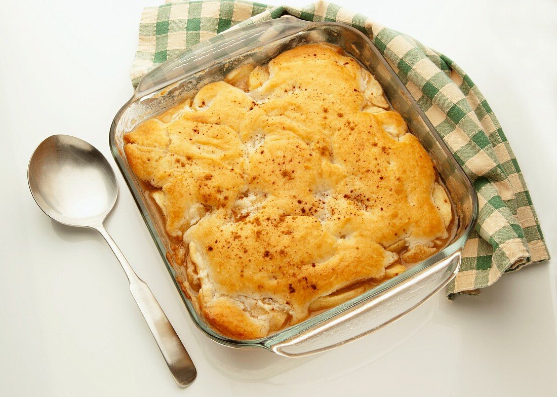 Apple pie tray bake in a glass baking dish