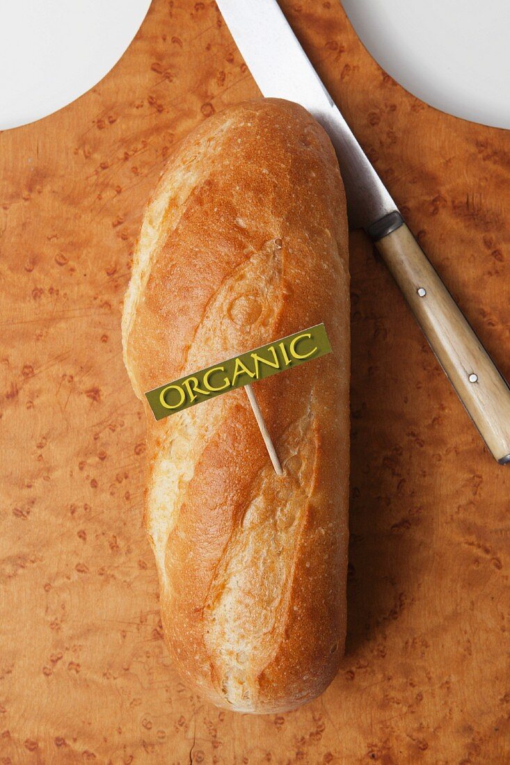 A loaf of organic bread with a label (seen from above)