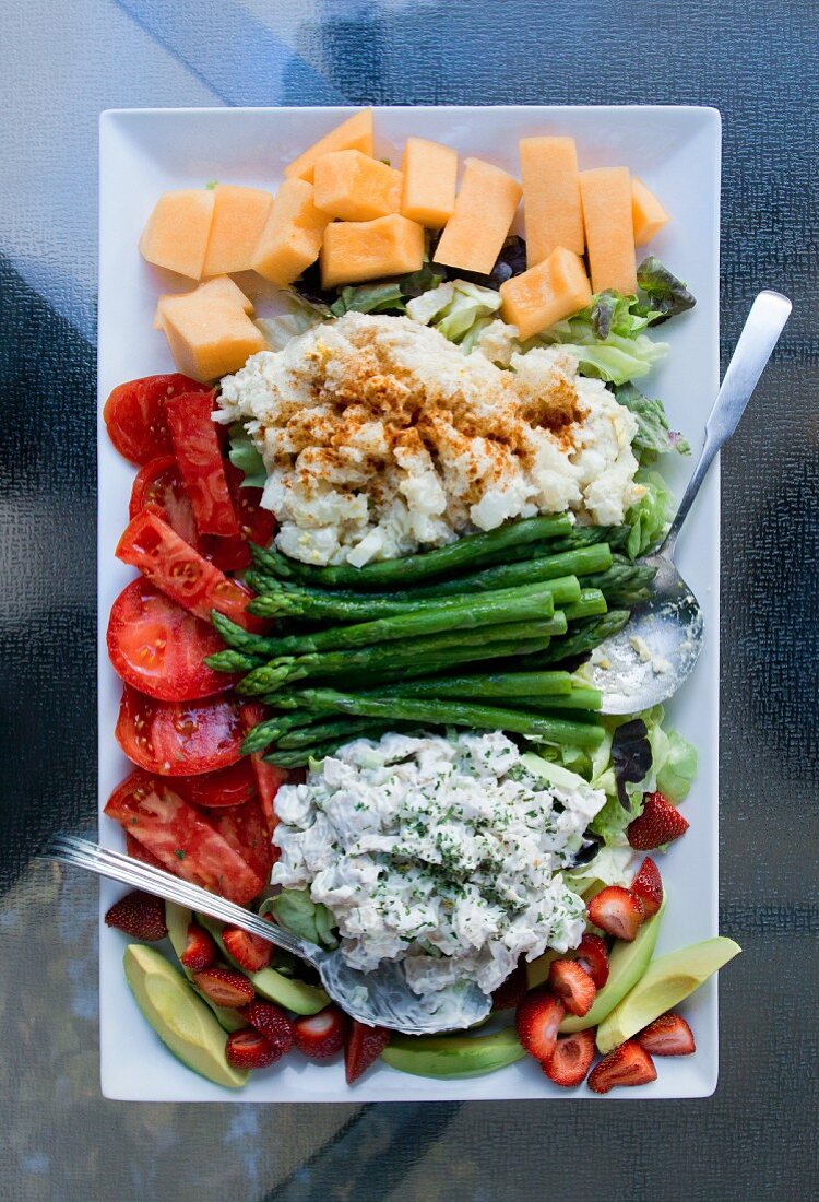 Salad platter with chicken, potato salad and vegetables (seen from above)