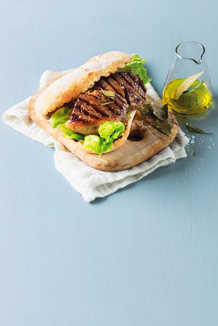 A grilled rump steak and salad sandwich