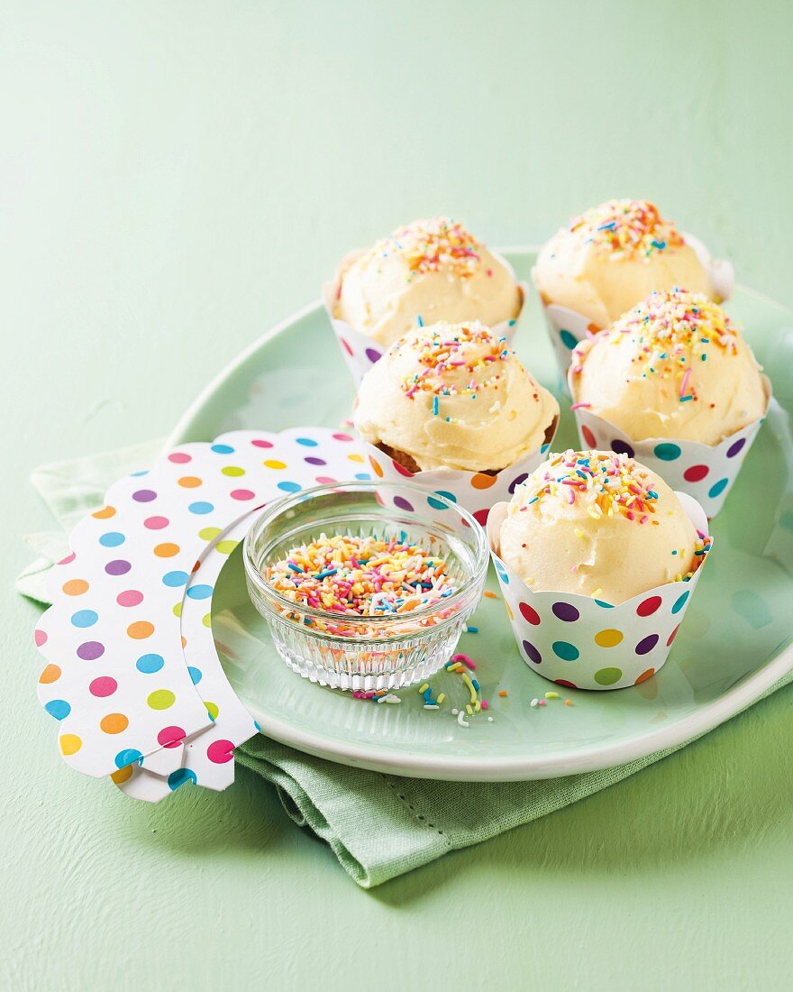 Cupcakes with butter cream and coloured sprinkles