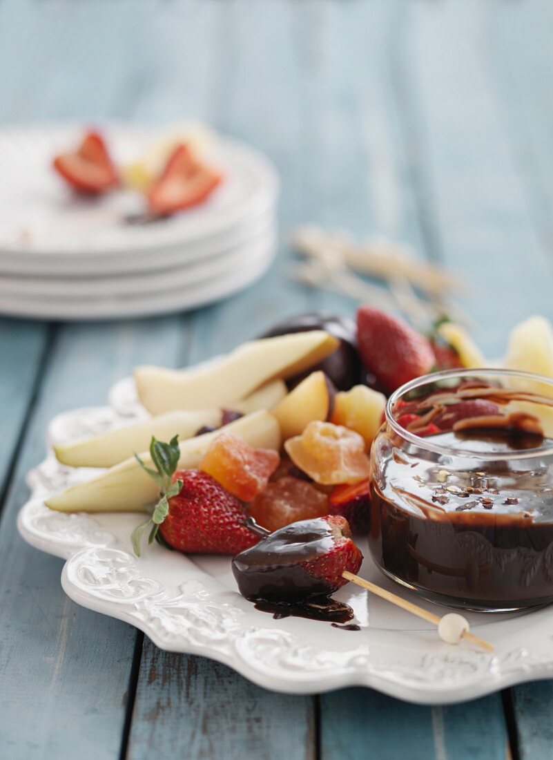 Fresh and candied fruits with a dark chocolate dip