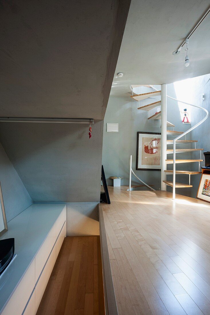 Bedroom and living area with concealed storage space in narrow house in South Korea