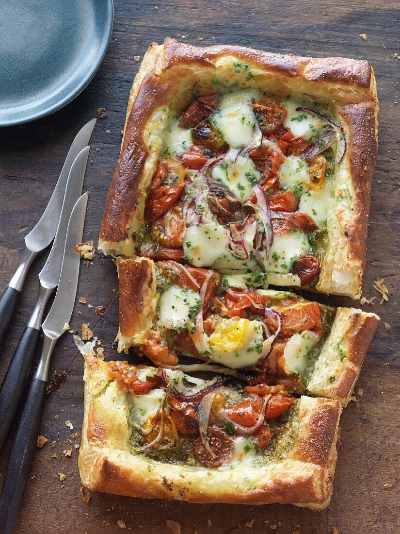 Puff pastry tart with pesto, tomatoes and mozzarella