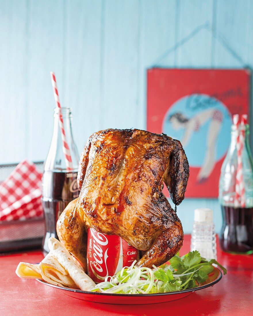 Roast chicken on a cola can