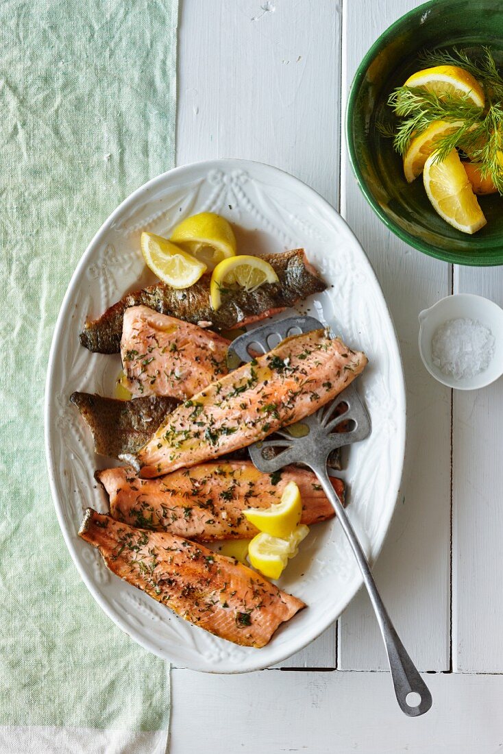 Grilled trout fillets with herbs and lemons
