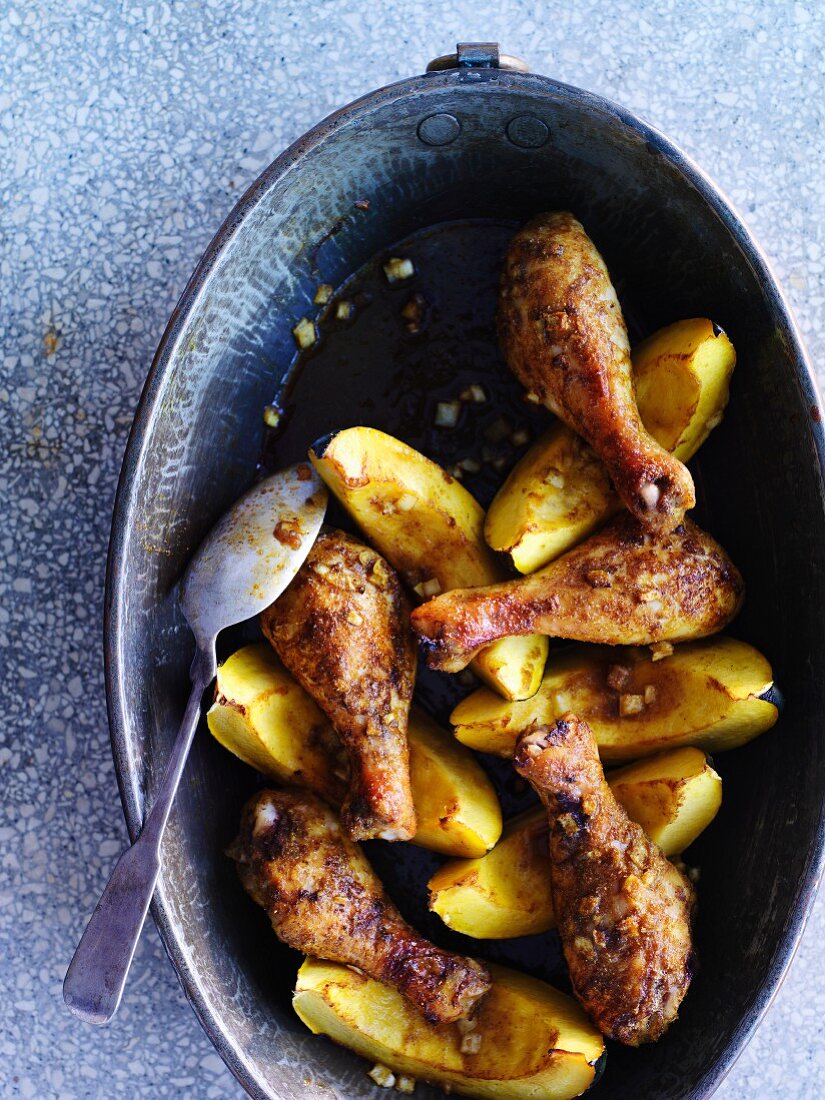 Chicken legs on pumpkin wedges (seen from above)