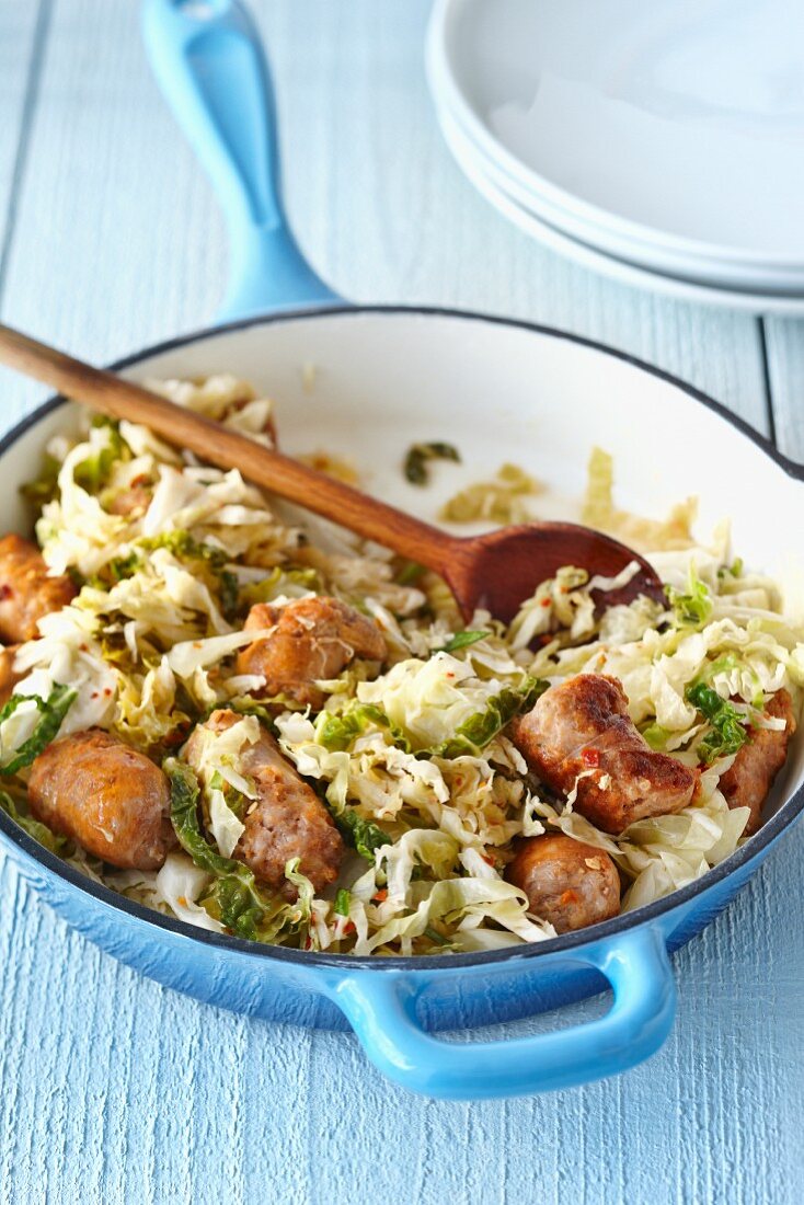 Fried cabbage with sausages