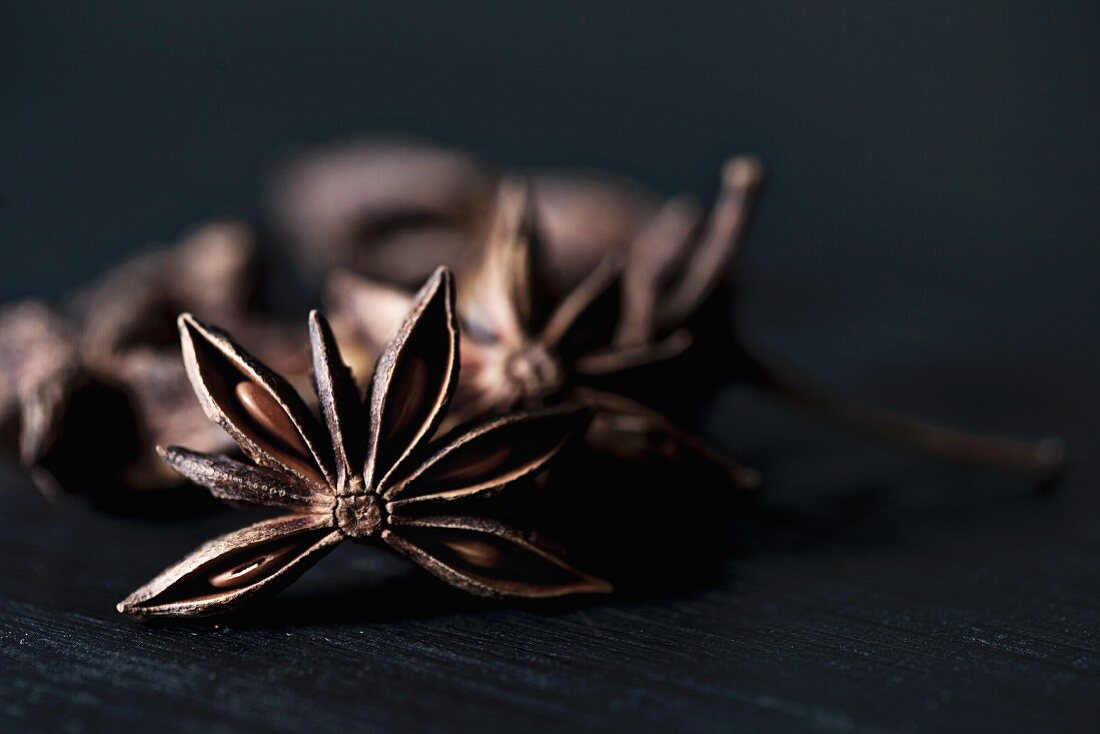Star anise on a black wooden table