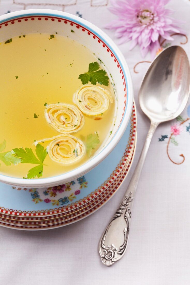 Clear broth with pancake rolls for Passover