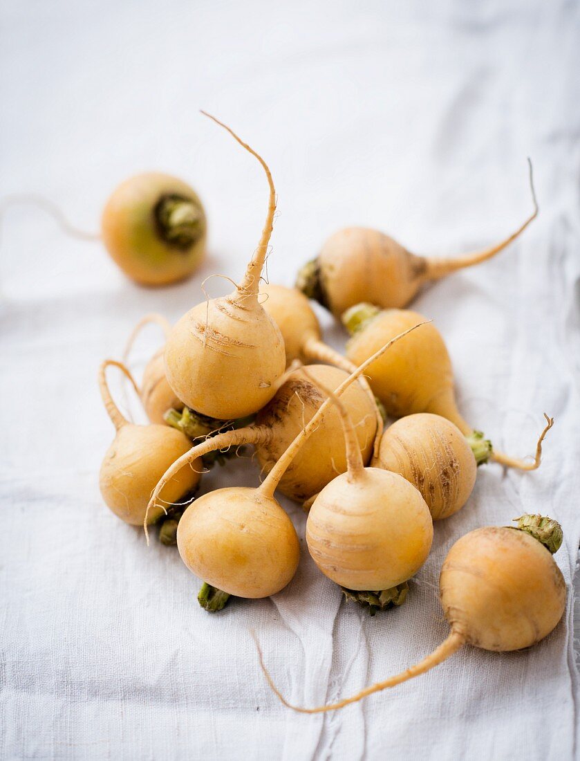 Golden beets on a white cloth