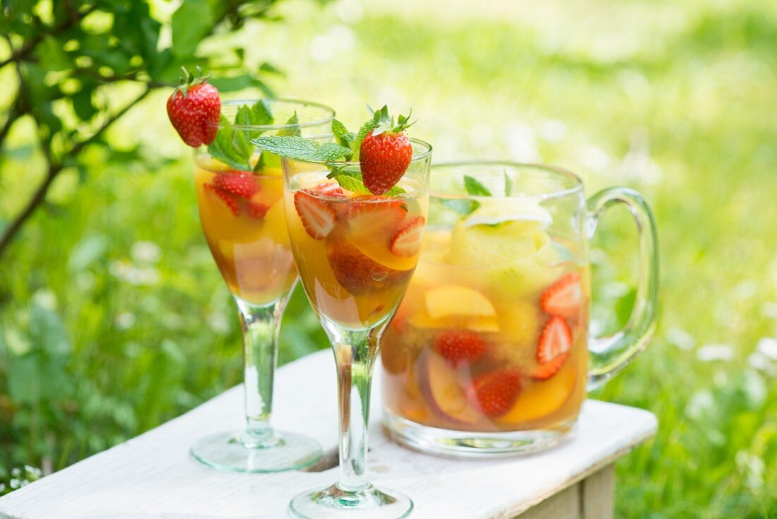 Summer drinks made with fresh fruit and berries