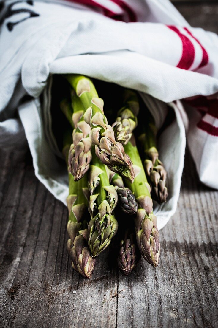 Green asparagus in a tea towel