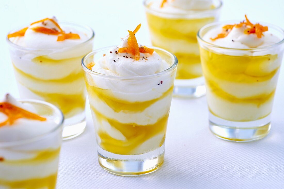 Spicy layered canapés with cream cheese, olive oil and orange zest