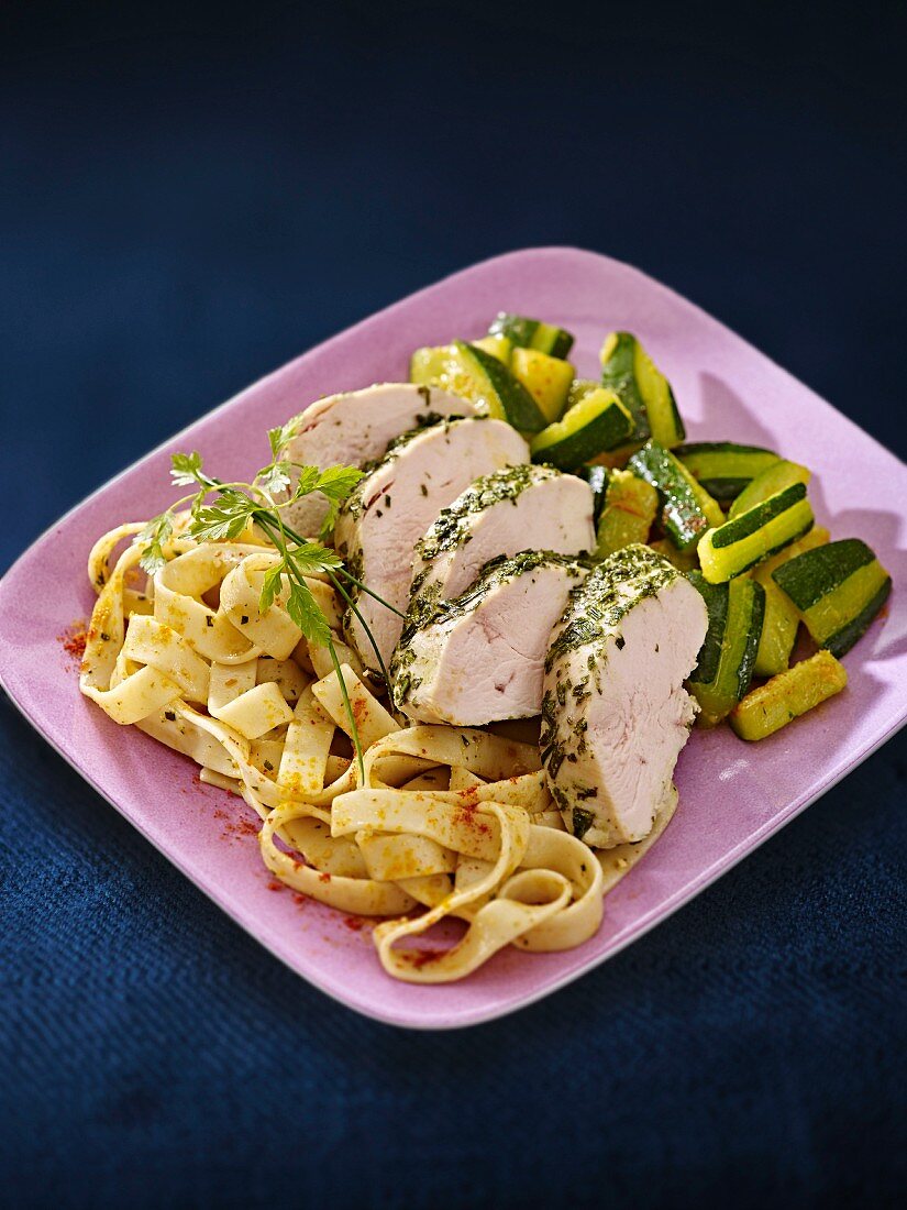 Herb chicken breast with a courgette medley and tagliatelle