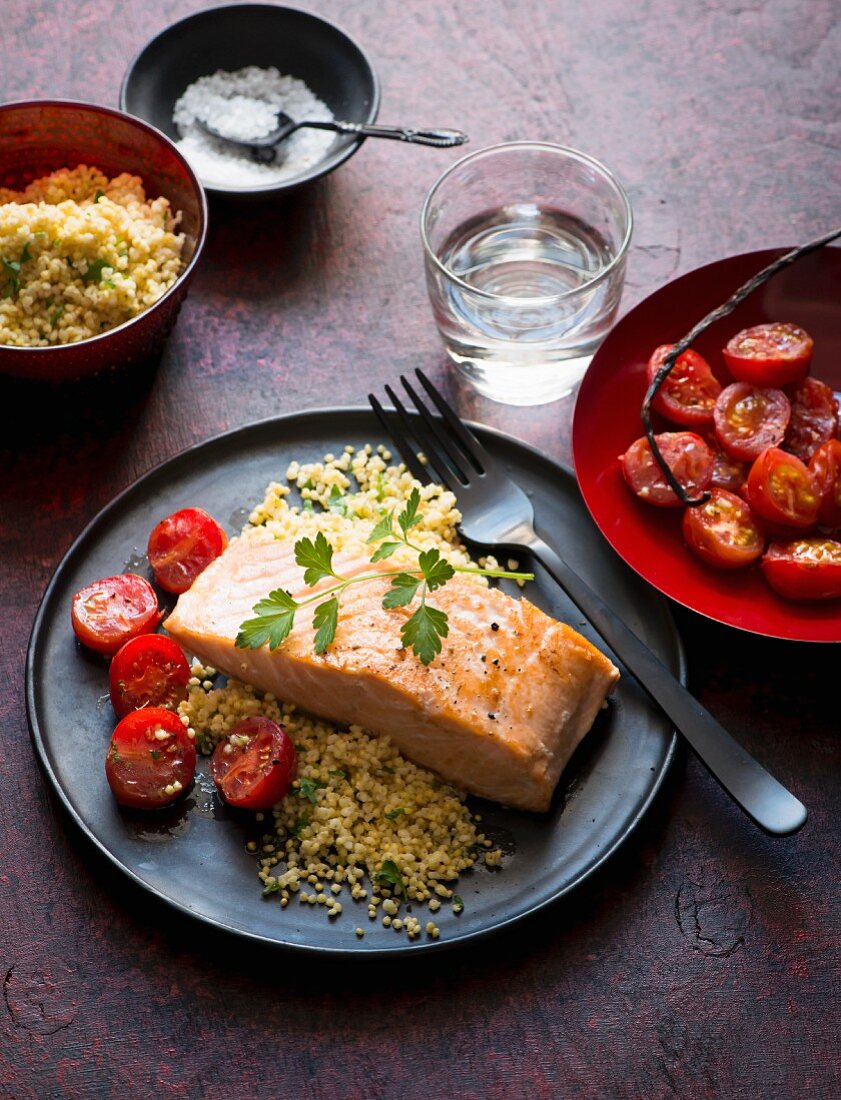 Salmon fillet with tomatoes and couscous