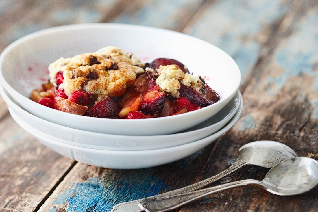 Fruit cobbler with plums, peaches and raspberries